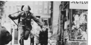 East German Policeman Jumping to the West at the Beginning of the Berlin Wall